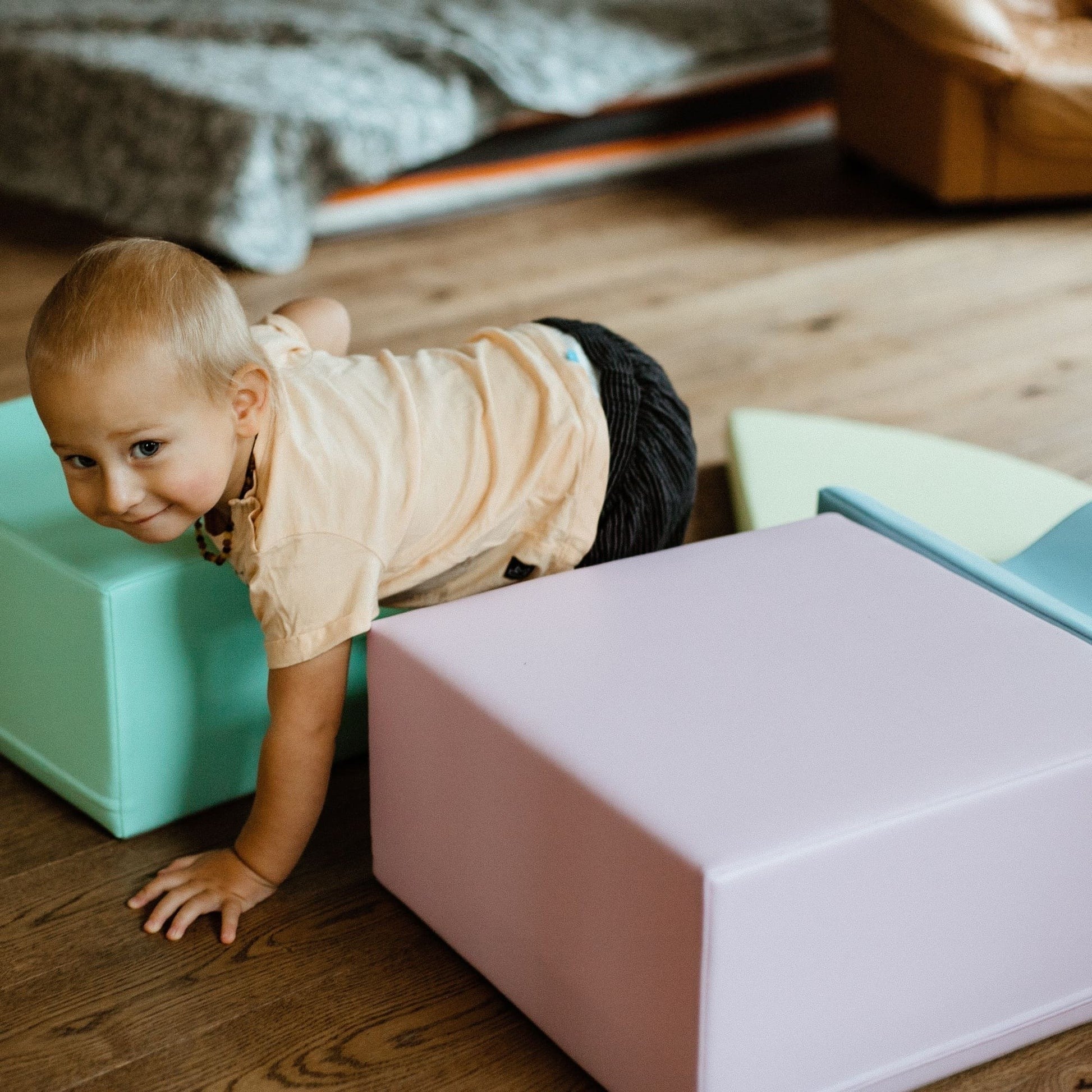 elegant pastel iglu foam blocks arranged in a creative archway for a toddler's imaginative play