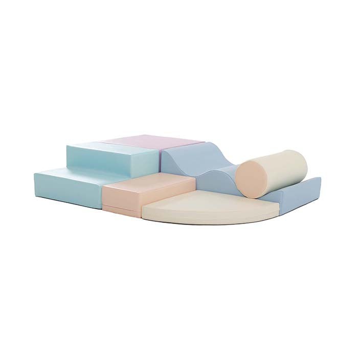 pastel iglu foam blocks arranged in a creative archway for a toddler to crawl through