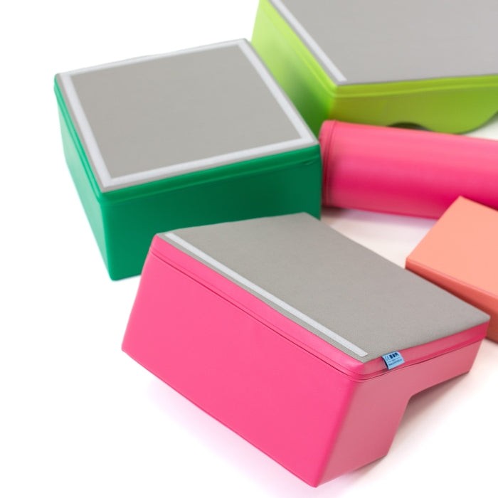 practical setup of iglu pink and green foam blocks arranged for easy toddler play and storage
