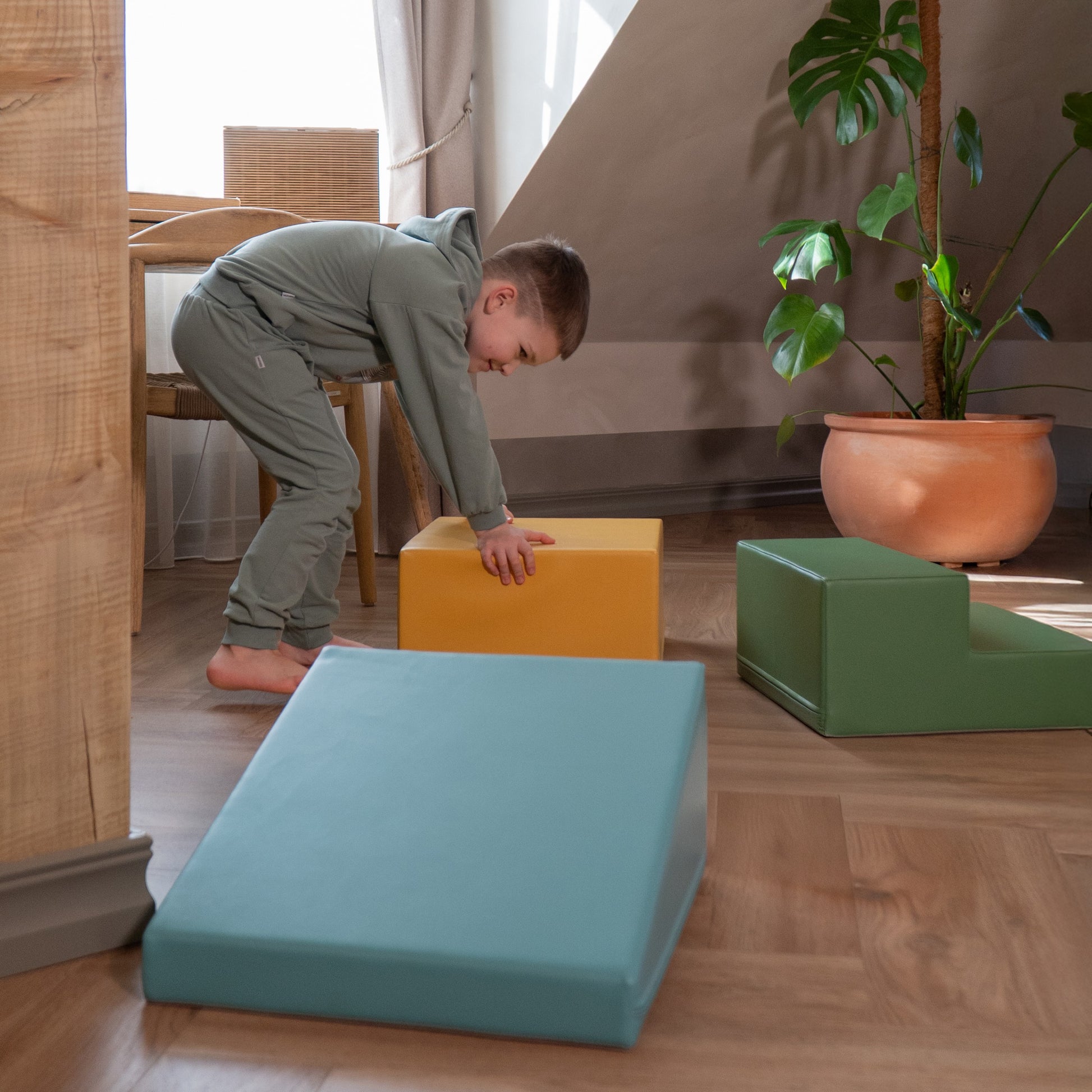 elegant pastel turquoise foam block set arranged as a sophisticated toddler playscape