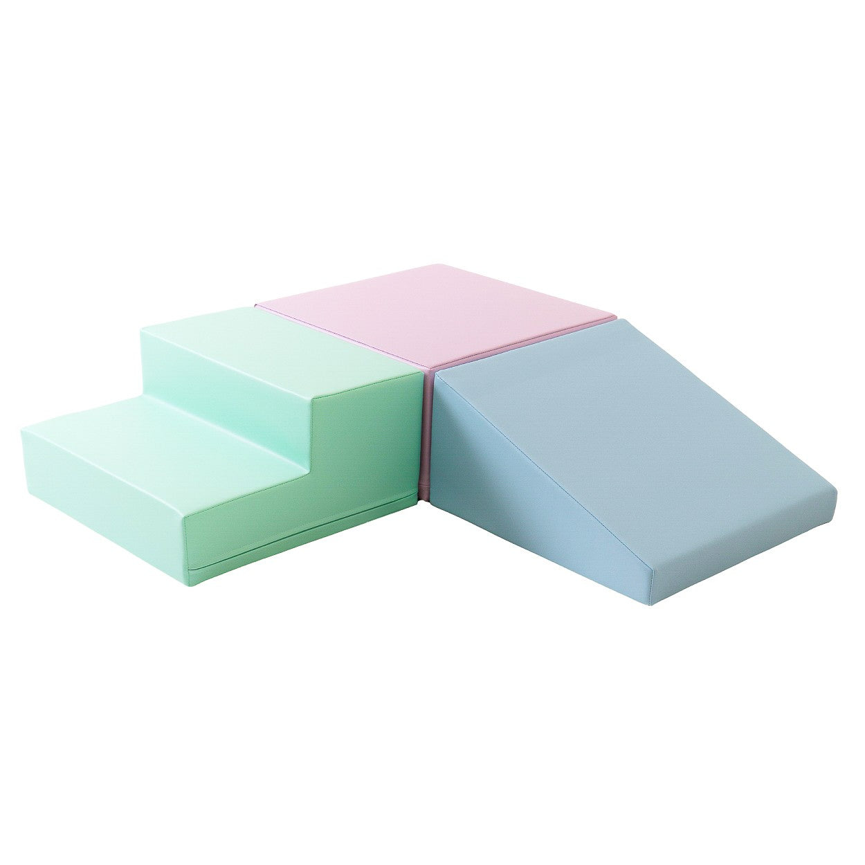 a toddler's hand touching a soft pastel foam block on a clean, minimalist background