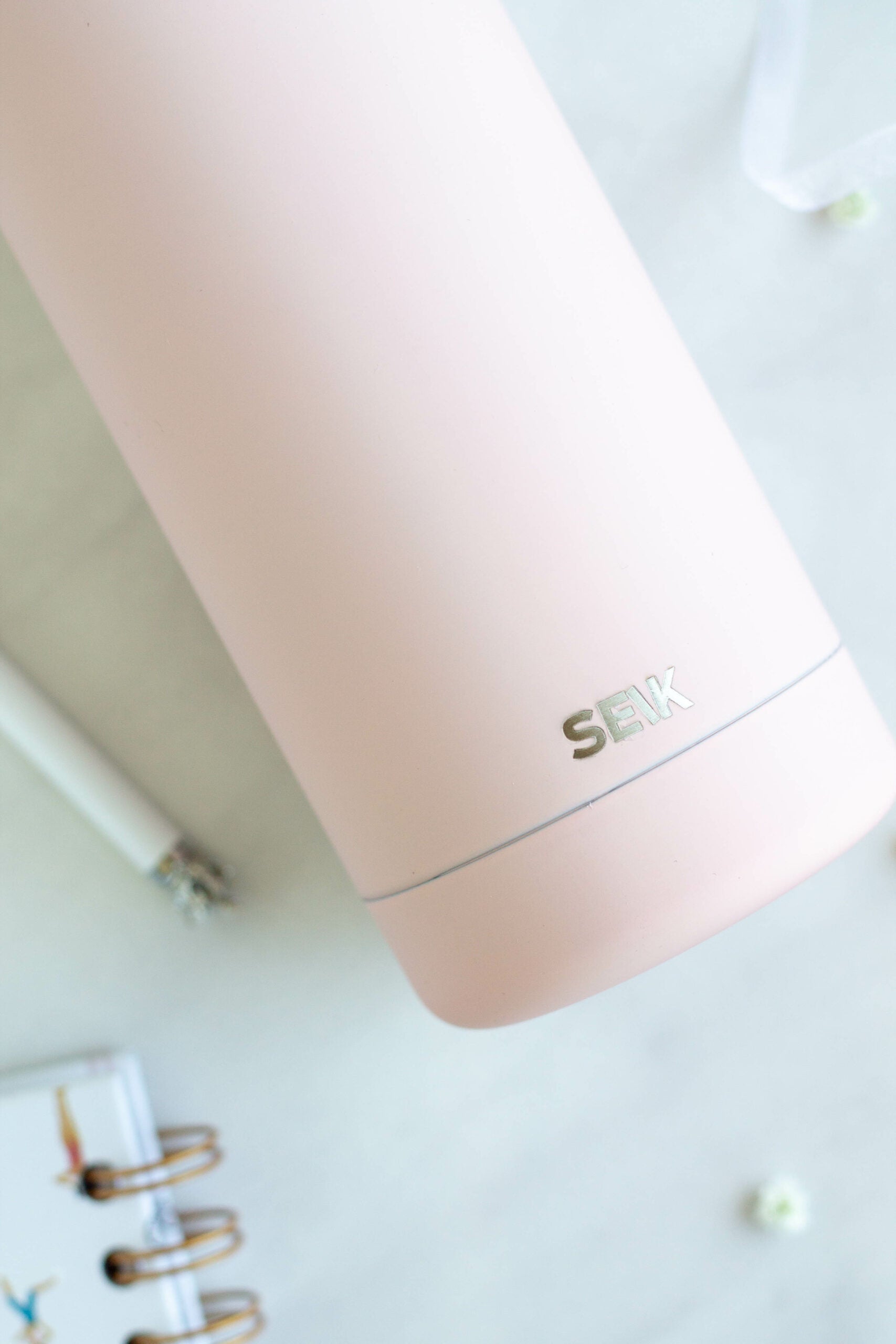 bold pink seik thermos with matte finish and leakproof cap on a minimalist background