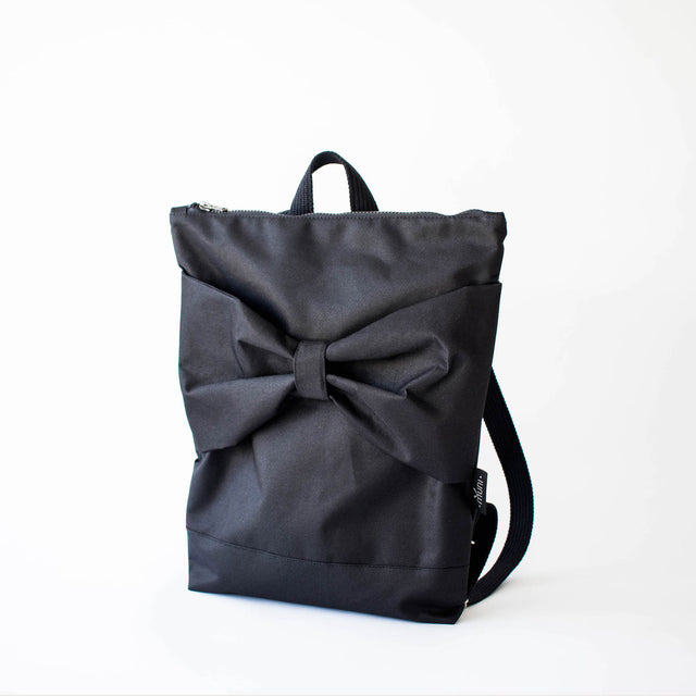 Chic Black Bow Backpack – Waterproof & Spacious for Everyday Use by Muni at brixbailey.com