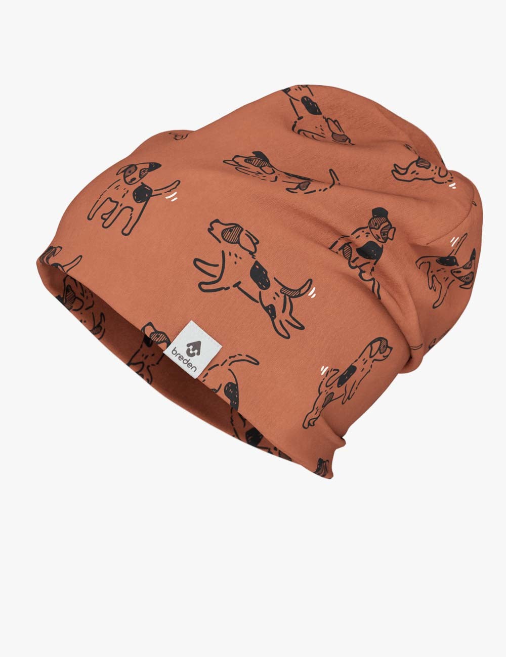 a child laughing while wearing a slouchy copper dog print beanie in a sunlit park