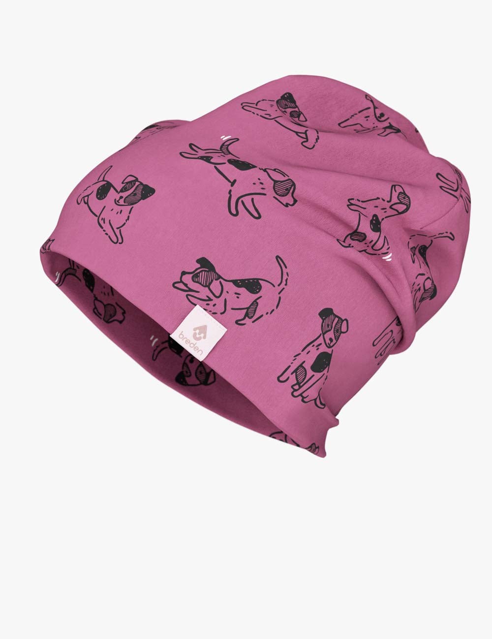a bold close-up of a kids pink dog beanie in dramatic morning light