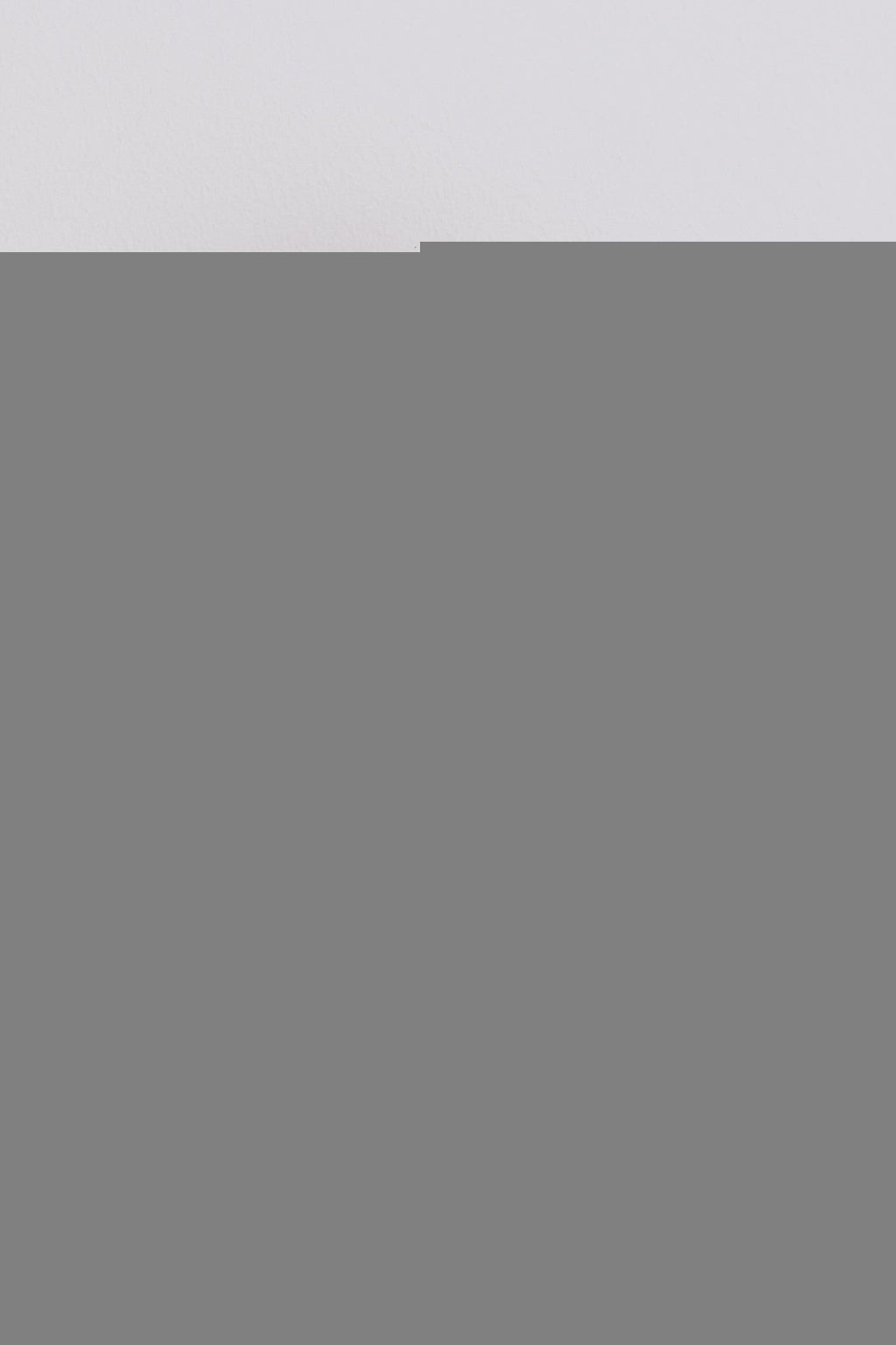 a child peeking playfully over a colorful floral merino neck tube