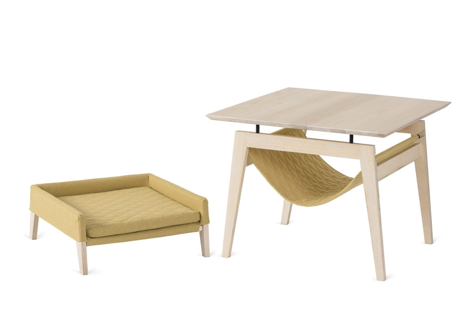 a playful cat peeking from the stylish honey finish lulu bed atop the kikko table