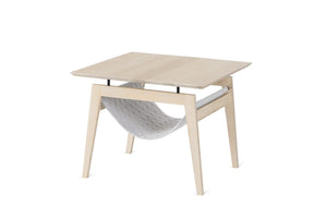bold light grey kikko table with integrated cat hammock in a modern living room