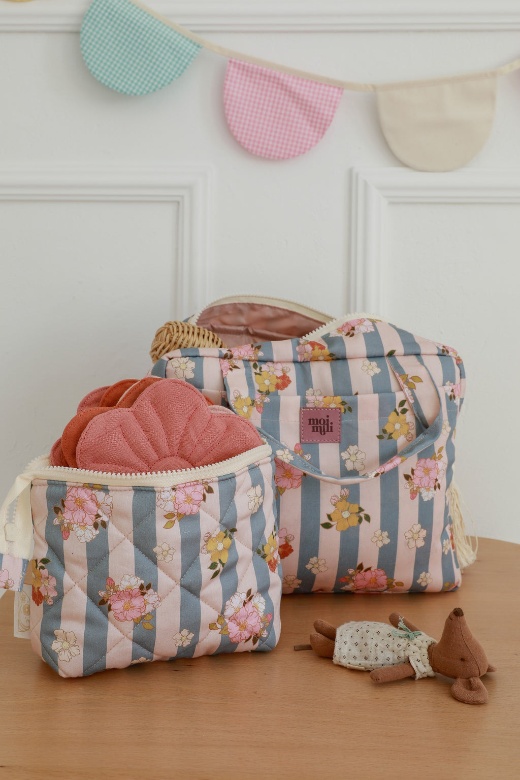 elegant blue striped cotton makeup bag with waterproof lining, open to show inner pockets, handmade in poland