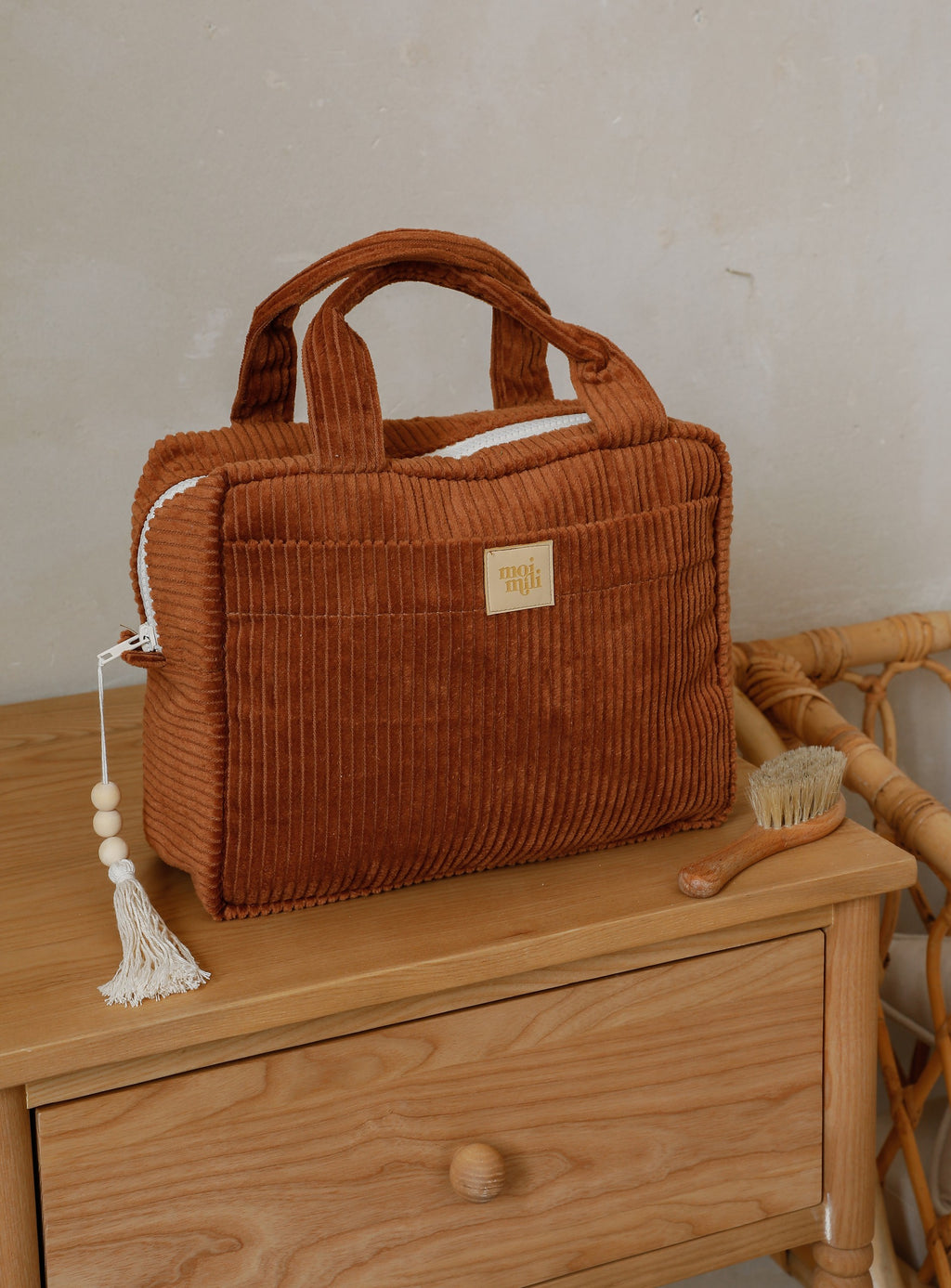 open caramel makeup bag showing its inner pocket and waterproof lining for practical organization