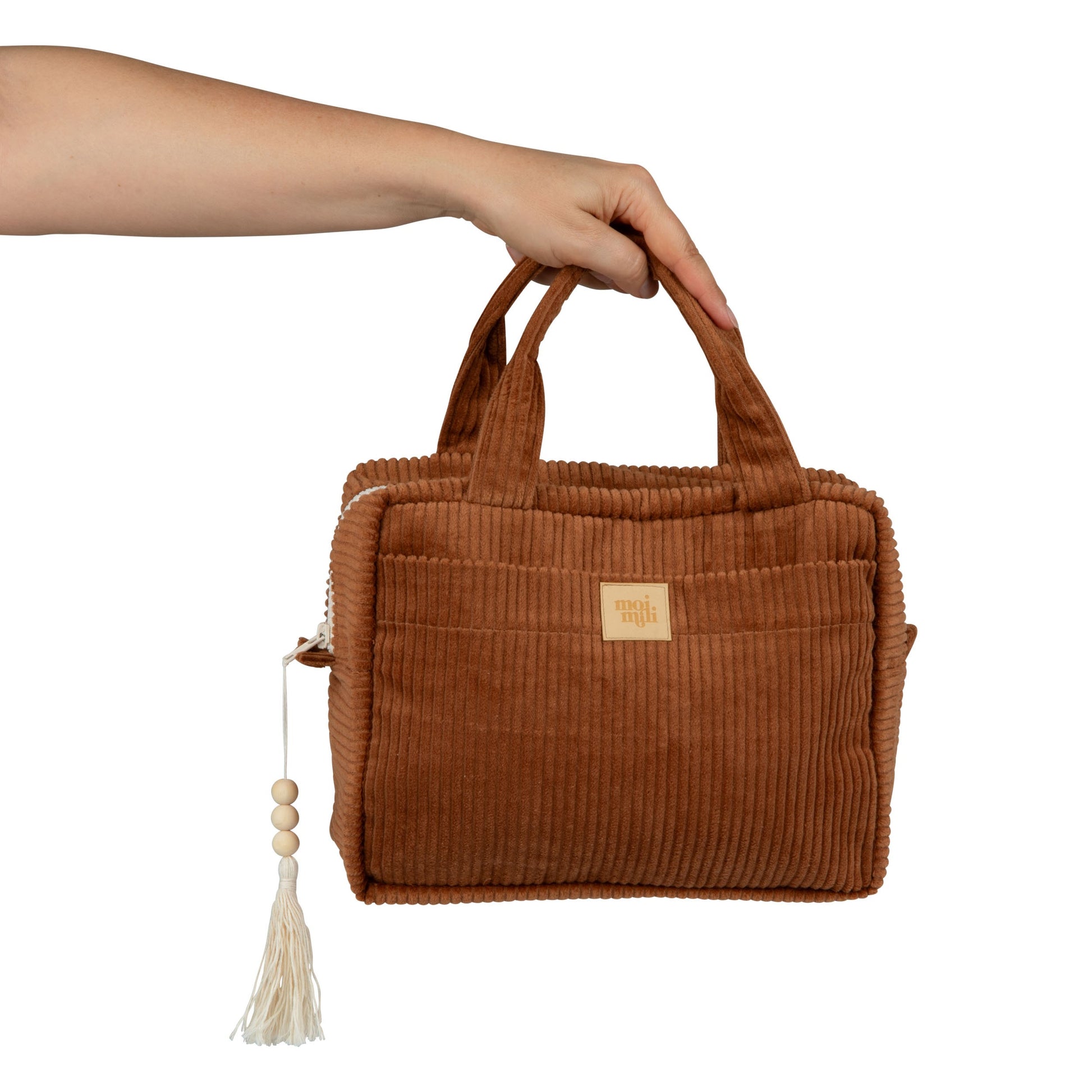 a functional caramel cotton makeup bag open to show its waterproof lining and inner pocket