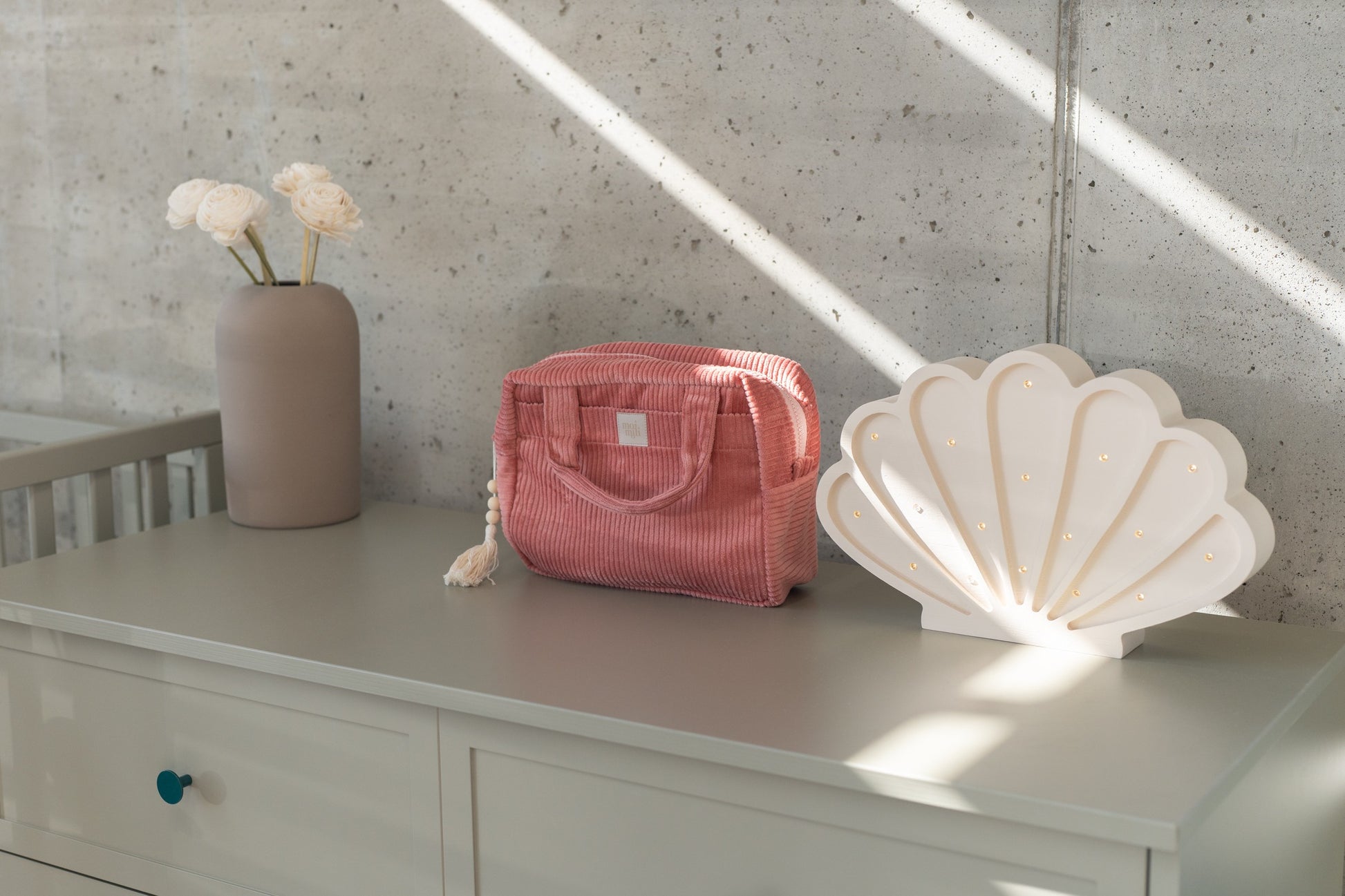 coral cotton makeup bag with waterproof lining, open to show inner pockets, practical for travel or daily use