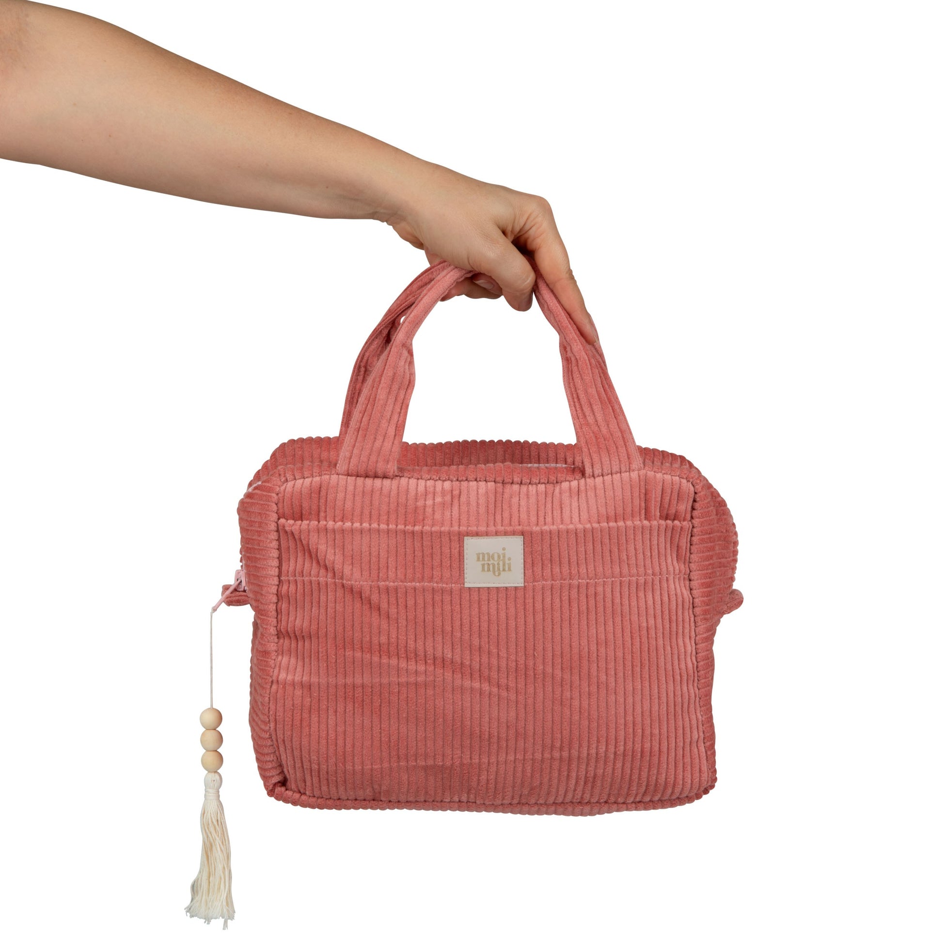 bold coral makeup bag with waterproof lining, open to show spacious interior and pockets