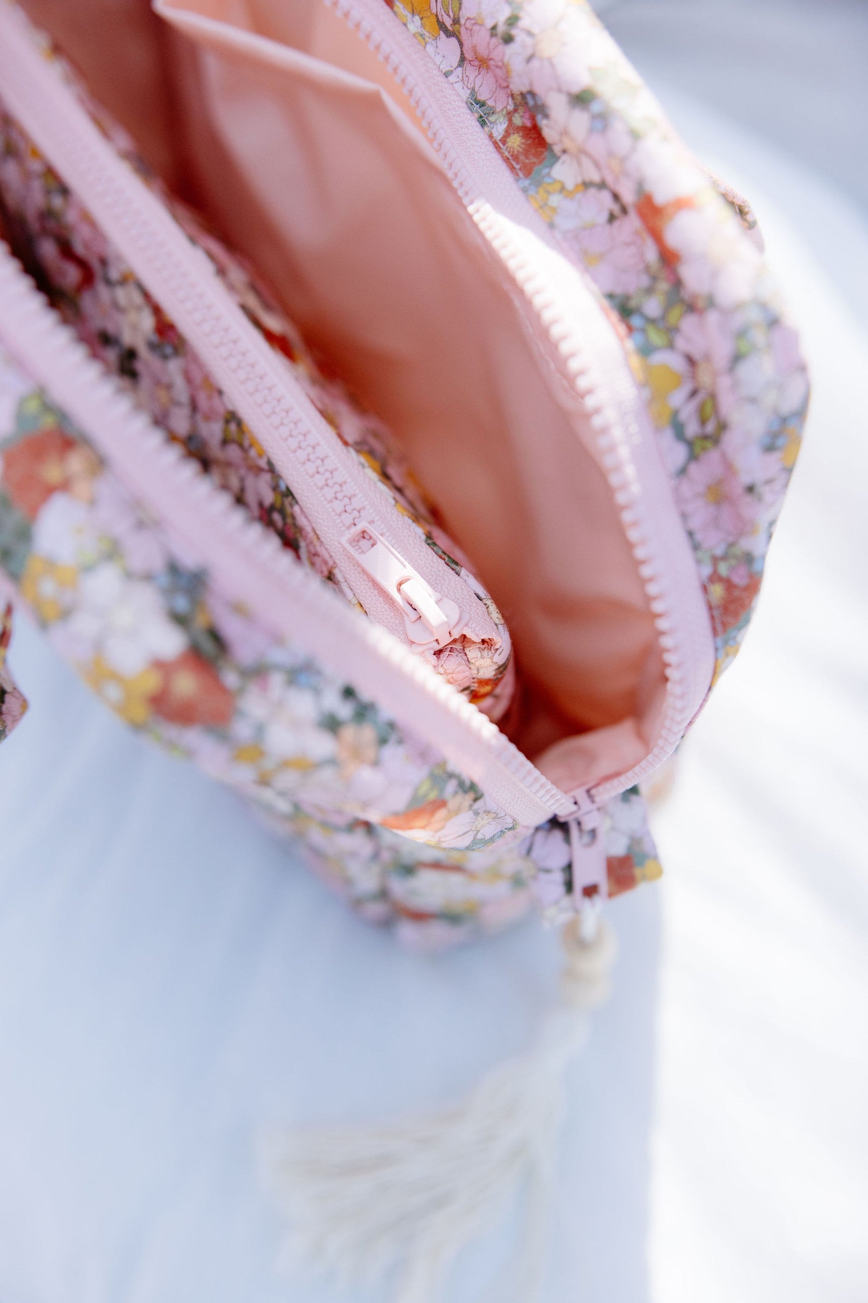 soft green garden makeup bag set with a smaller pouch resting gently on top