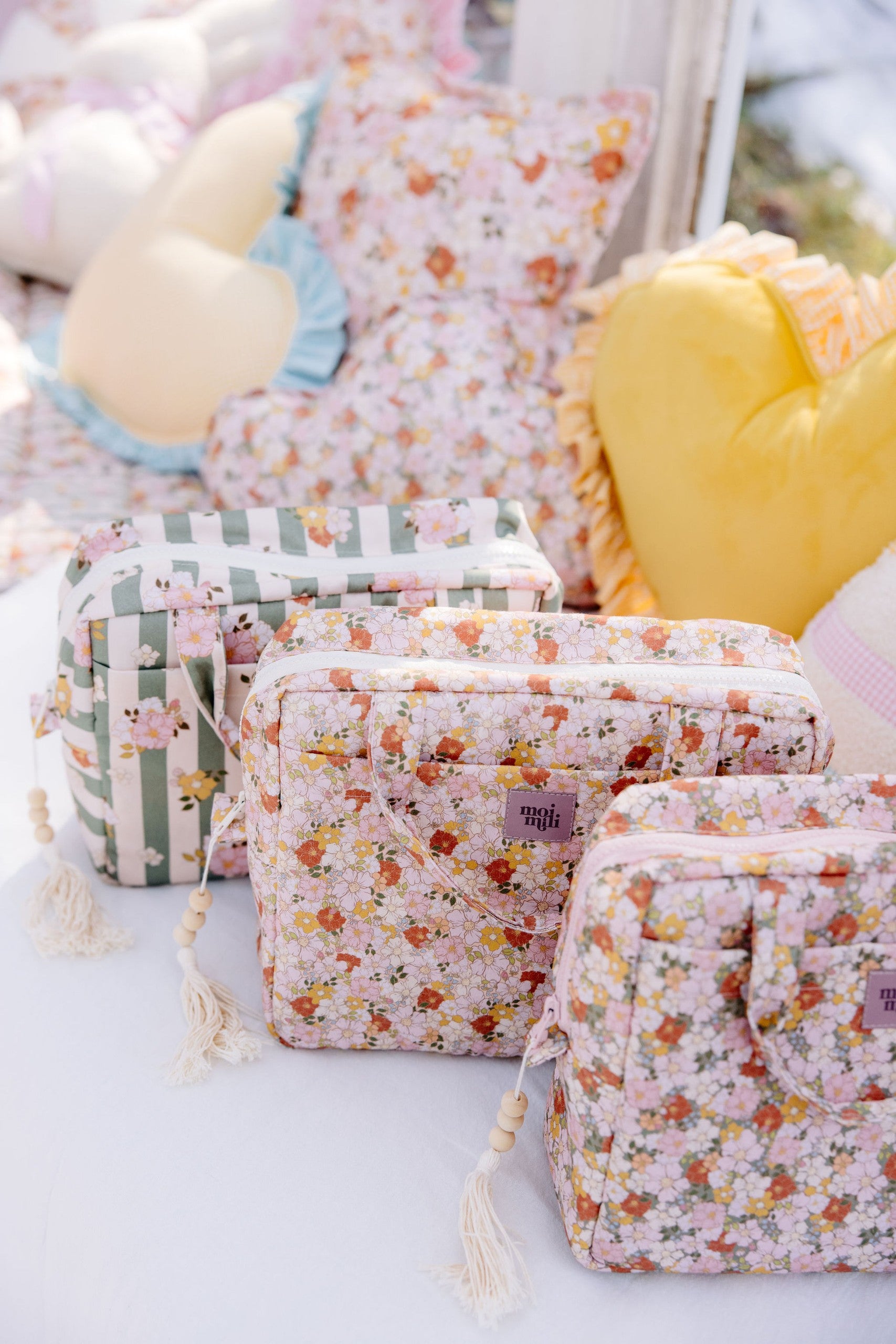 soft green garden makeup bag with cotton exterior and waterproof lining, open to show inner pockets