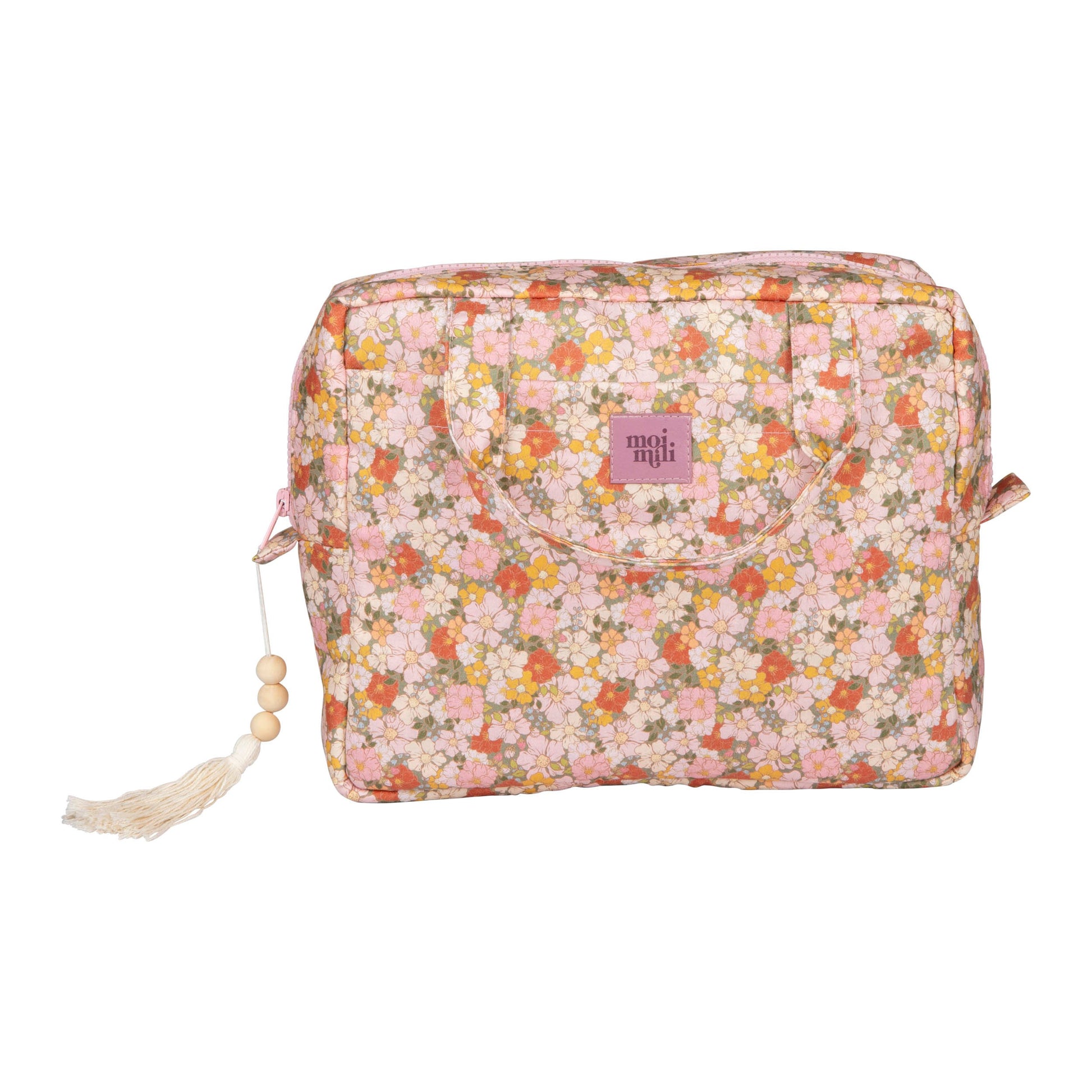 playful green garden makeup bag held open on a sunny day, showing its spacious cotton interior