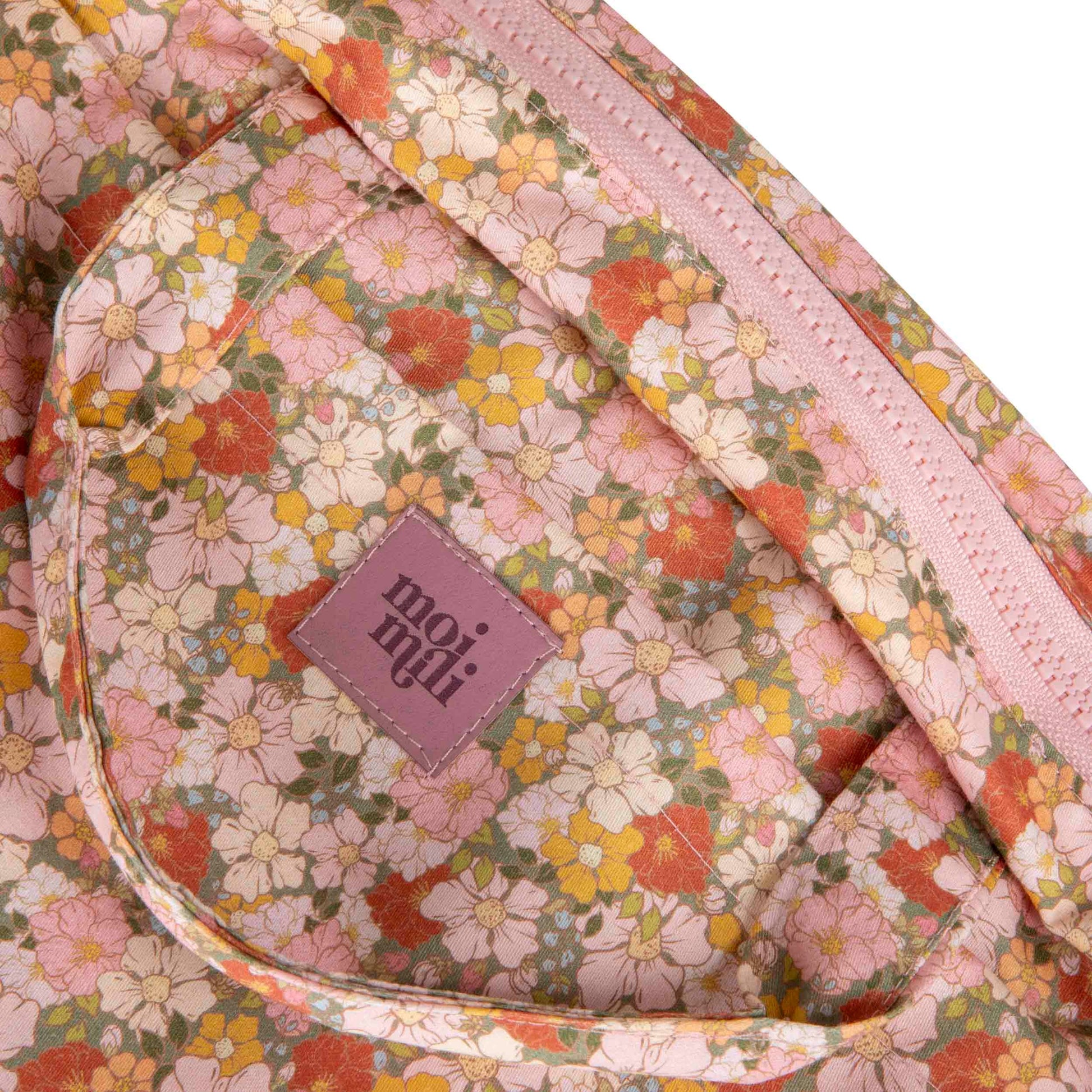 elegant green cotton makeup bag with waterproof lining and pockets, open to reveal its spacious interior