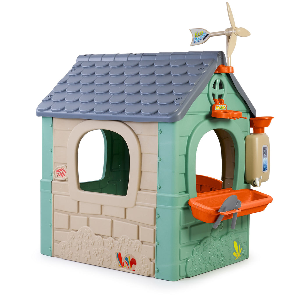 kids playing in a recycled eco playhouse with wind turbine and solar panels under golden sunset light