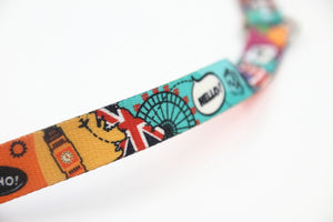 a soft-focus close-up of the travel leash's eiffel tower pattern on a cozy background