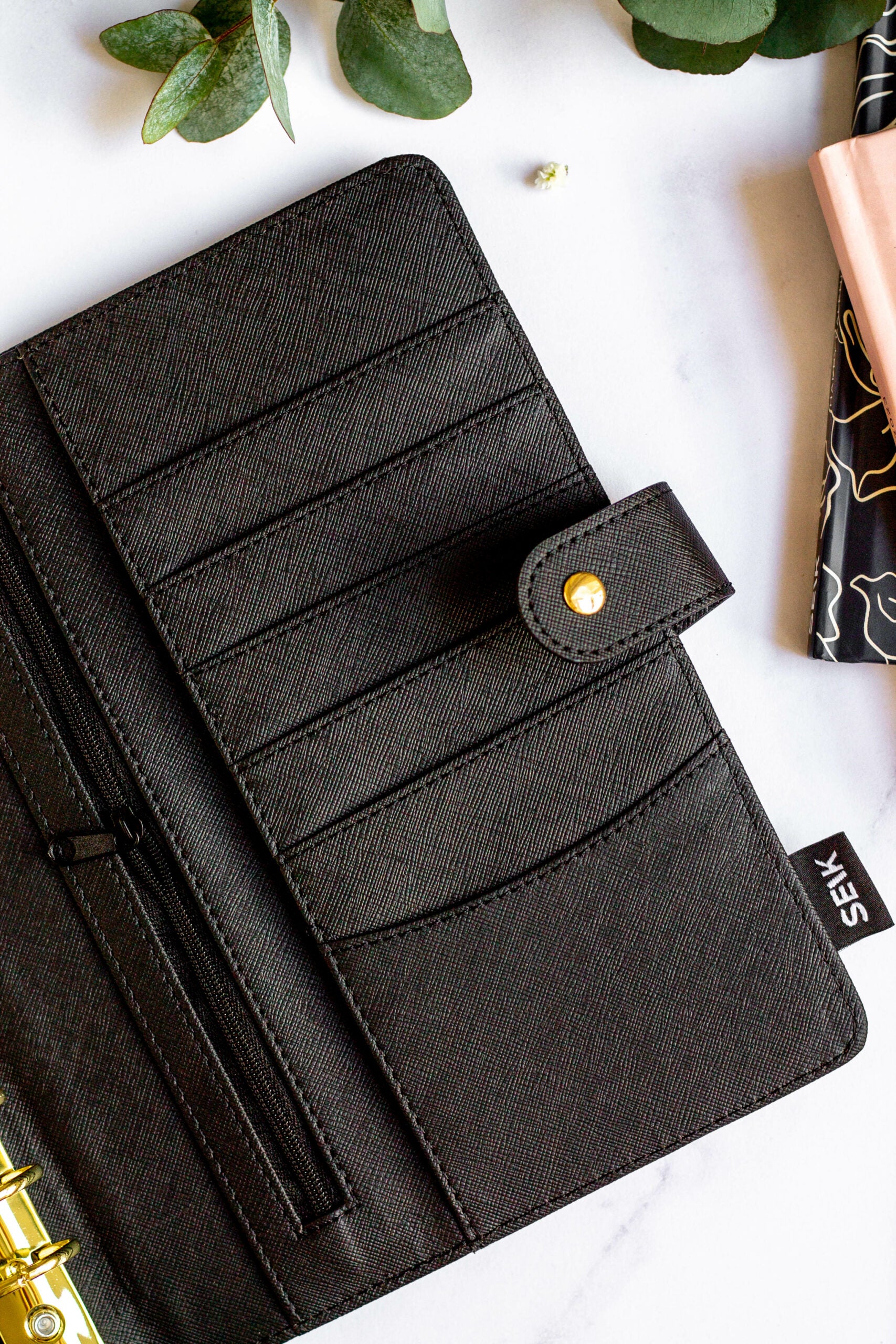 a playful close-up of the vegan leather notebook's dot-grid pages and colorful pen
