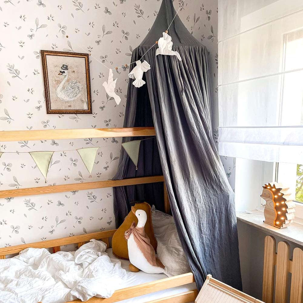 a playful stork flying over a serene lake on matte paper leaves minimini wallpaper for a kids room