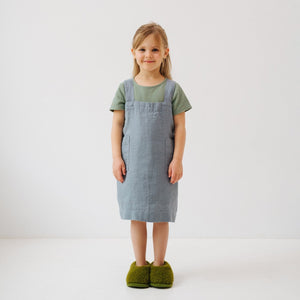 soft blue fog kids linen pinafore apron in gentle morning light