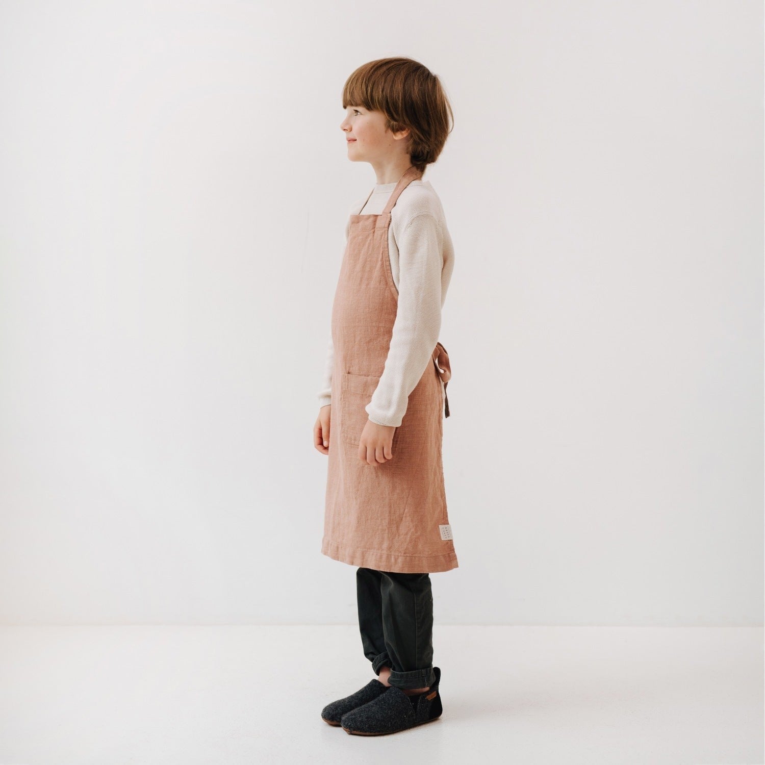 functional kids linen apron in cafe creme with front pocket, adjustable ties, and durable stone-washed fabric for kitchen play