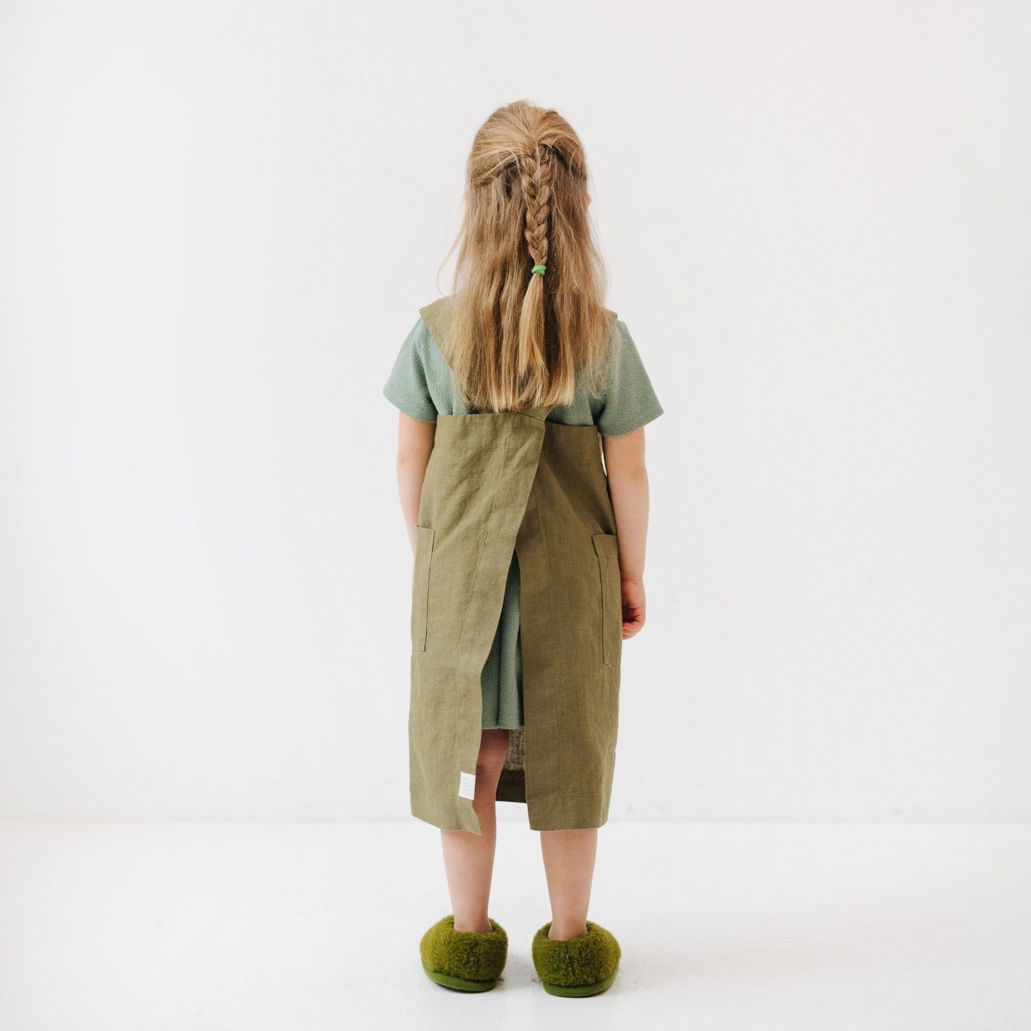 playful olive linen pinafore apron for kids with pockets, perfect for messy kitchen adventures