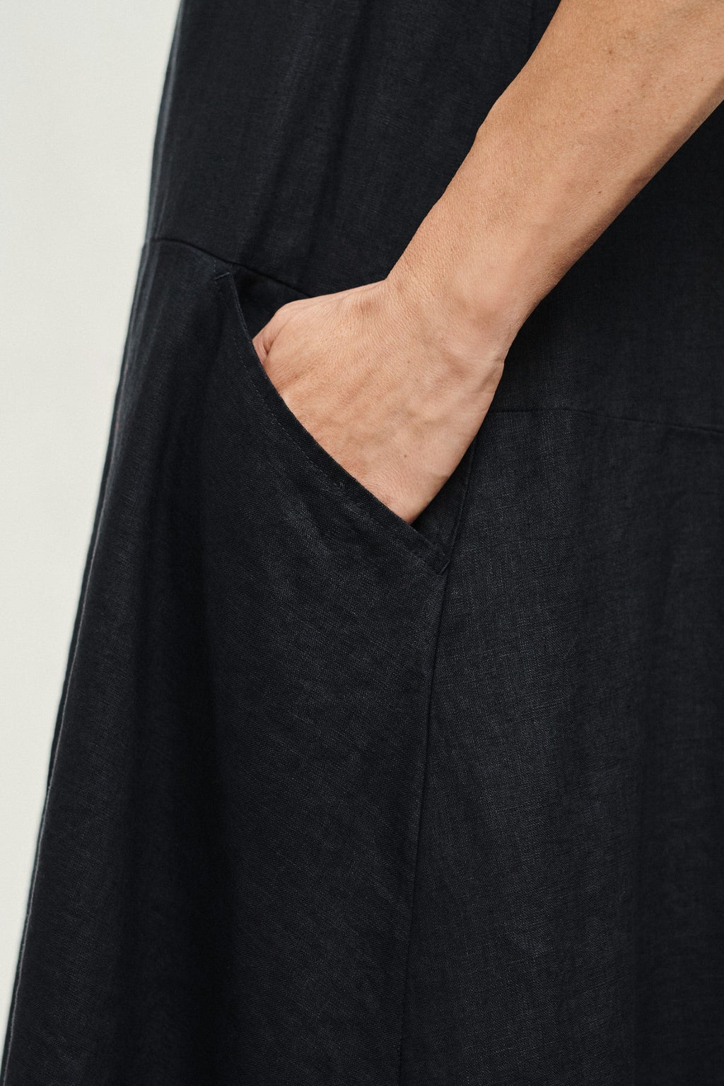 elegant black linen speedwell dress with a-line silhouette, captured in soft afternoon light