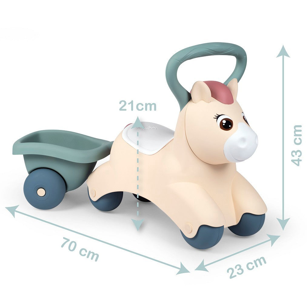 adorable pastel pony ride-on with trailer for toddlers, bathed in soft morning light, ready for playful adventures