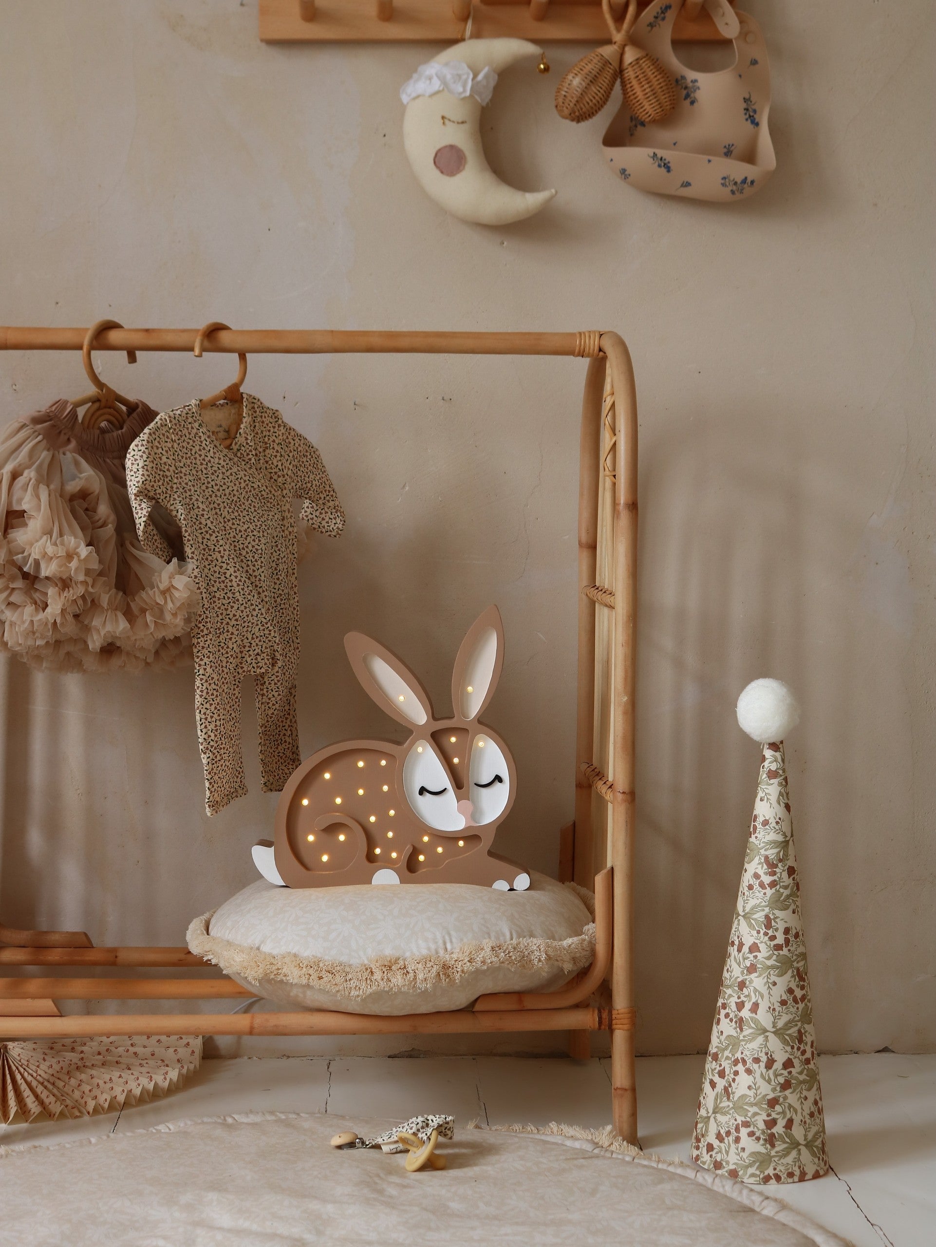 handcrafted pine wood cat lamp casting a warm glow on a child's bedside table