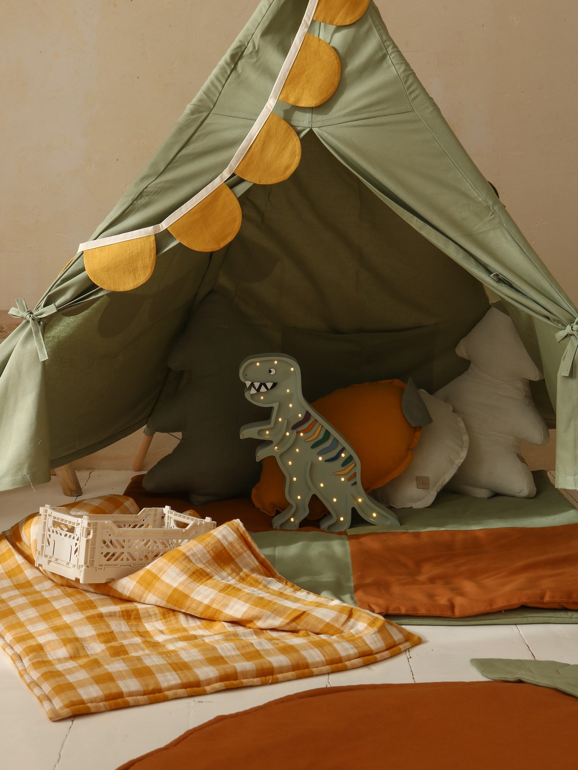 handcrafted pinewood t-rex lamp casting a soft, warm glow on a child's nightstand