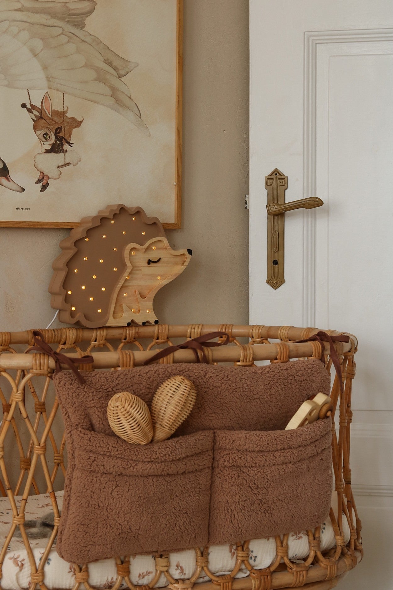 elegant close-up of a handcrafted pine hedgehog night lamp with warm glowing led light