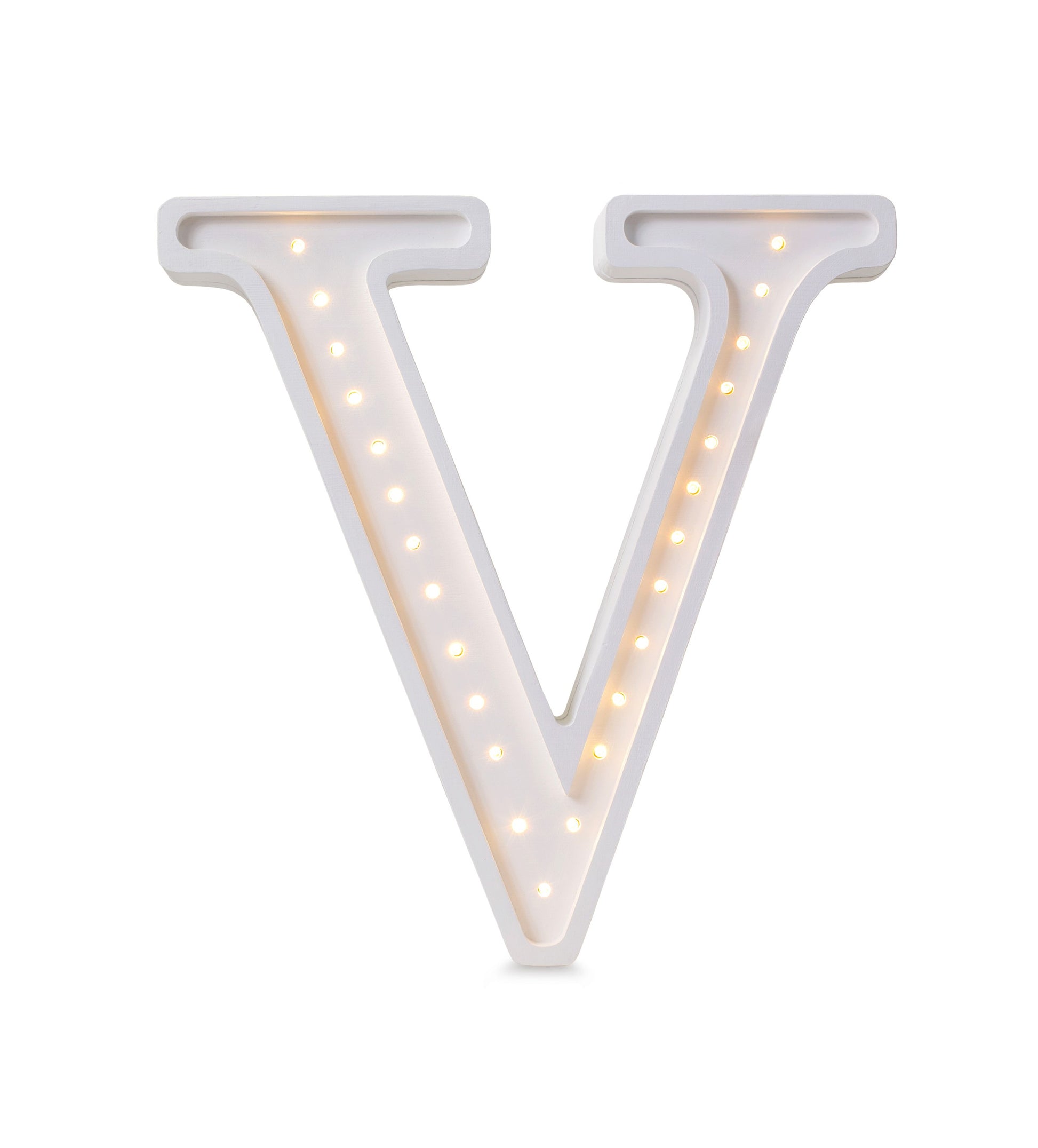 softly glowing letter v lamp casting a warm cozy light on a pinewood nightstand