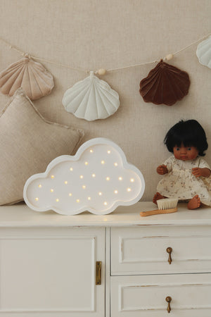 bold handmade pine cloud lamp casting a warm glow in a child's room