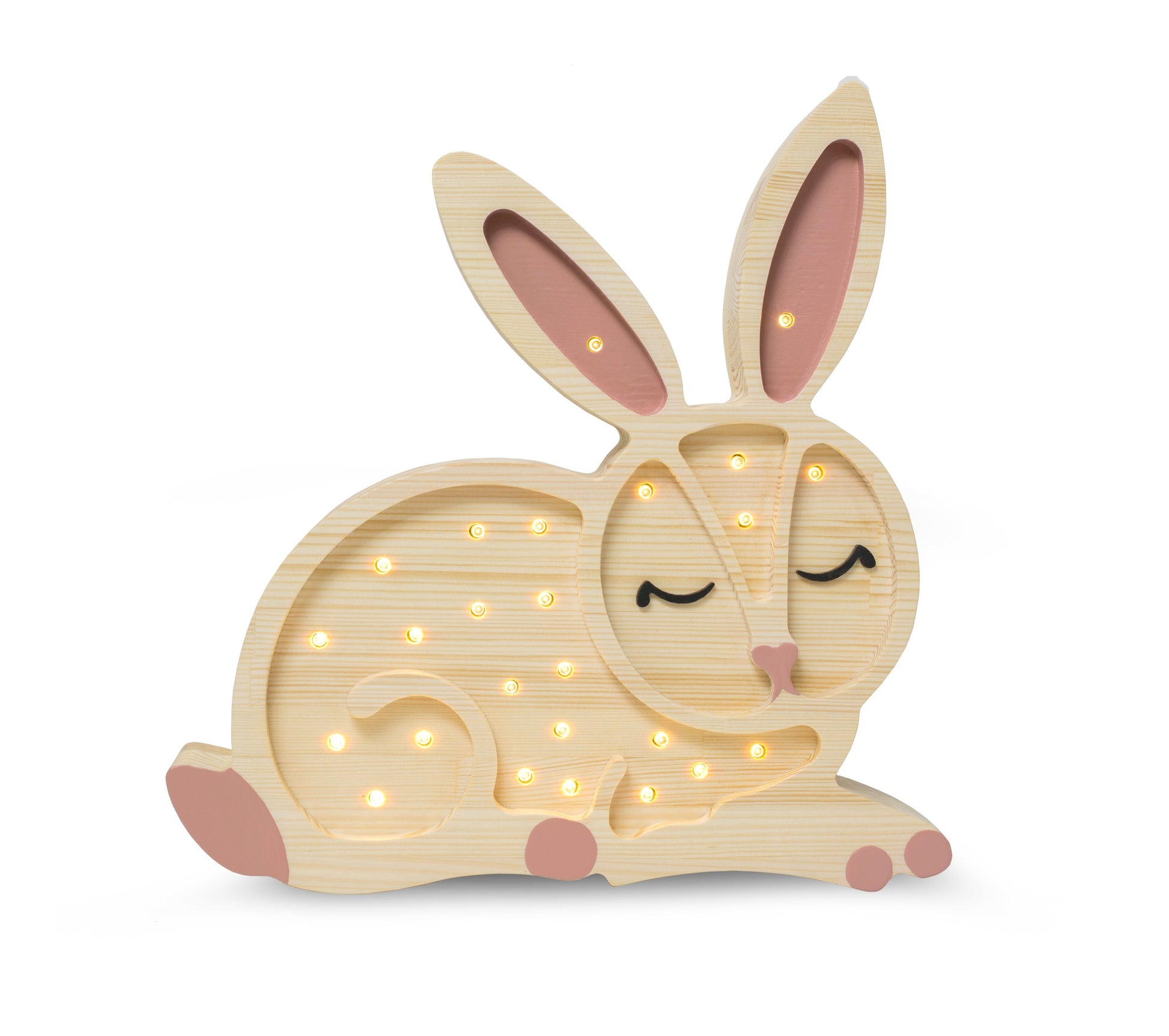 handmade pine bunny lamp casting a warm glow on a nursery shelf