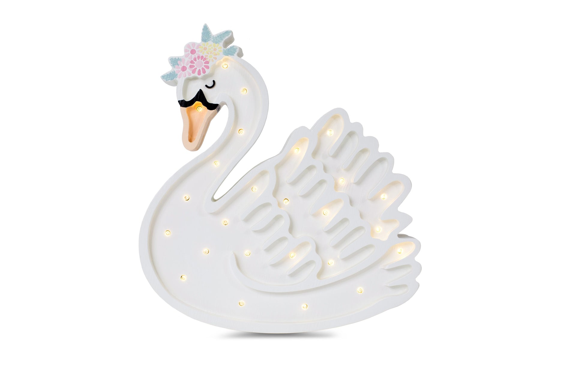 handcrafted pine swan lamp casting a soft glow on a wooden nightstand