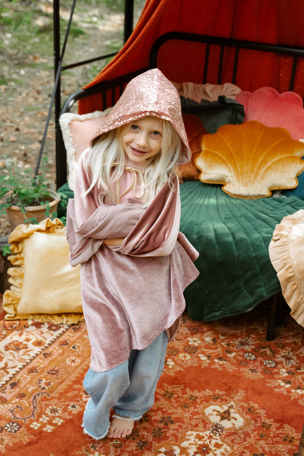 handmade pink velour cape with snap fastenings shown in soft morning light