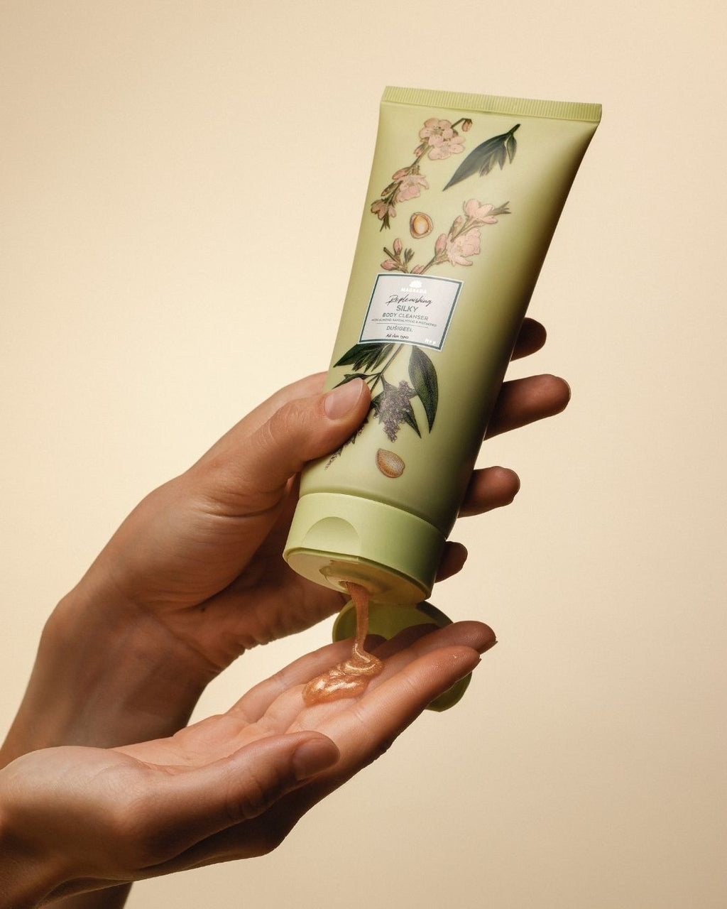 bold golden shimmer of magrada x lauren moisturizing shower gel with cucumber extract, glowing under warm light