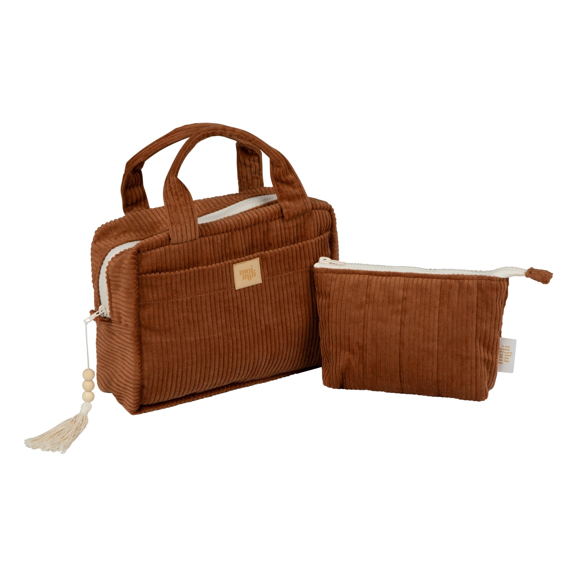 two caramel cotton makeup bags on a rustic wooden table with morning light