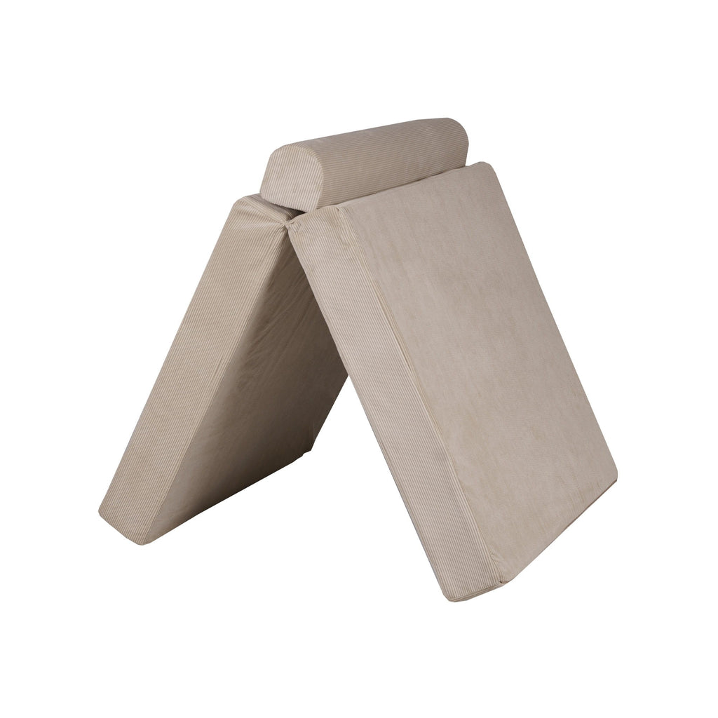 a child's ecru corduroy sofa with two poufs in a softly lit, contemporary living room