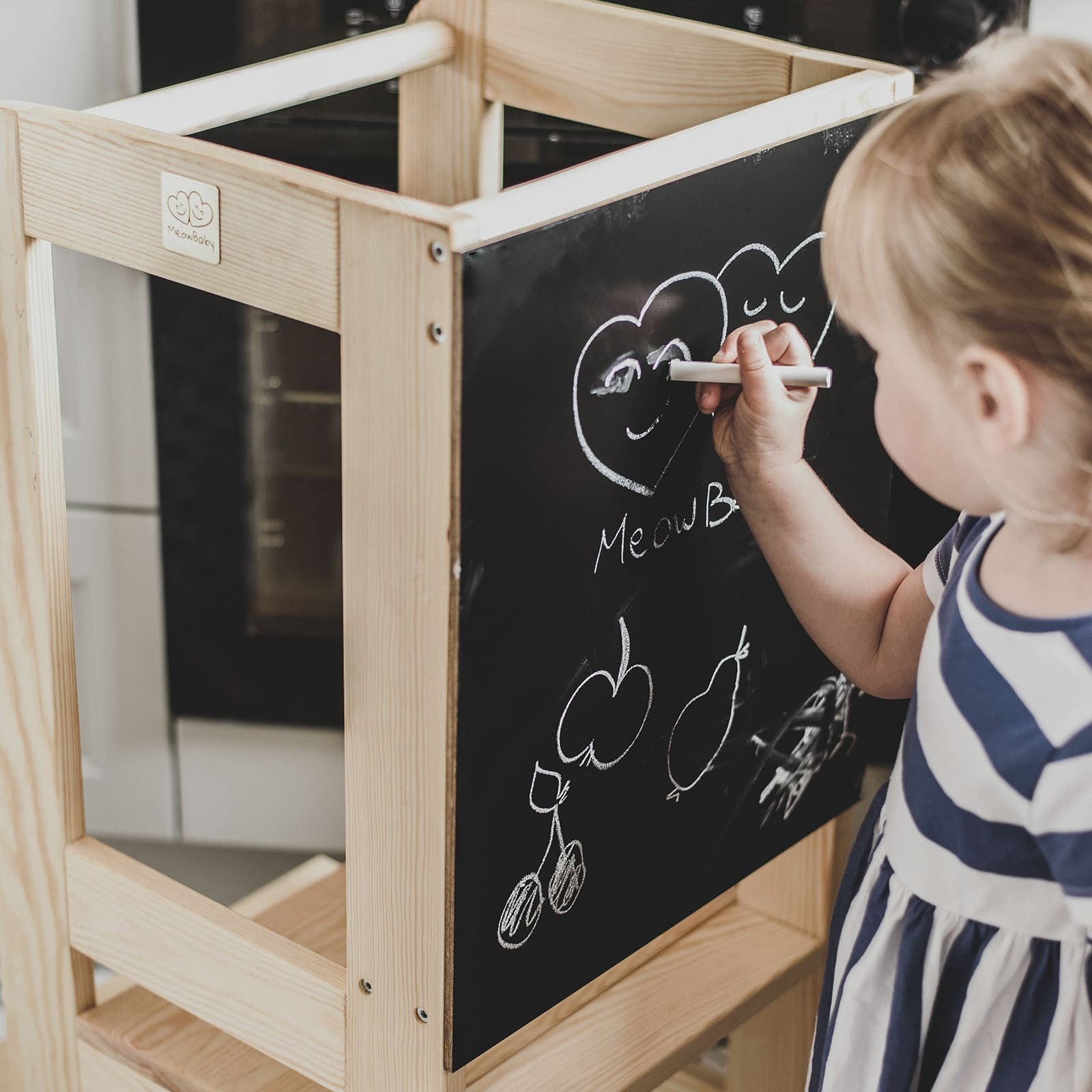 meowbaby wooden kitchen helper stool at a sunlit counter, functional and practical for a toddler to help cook