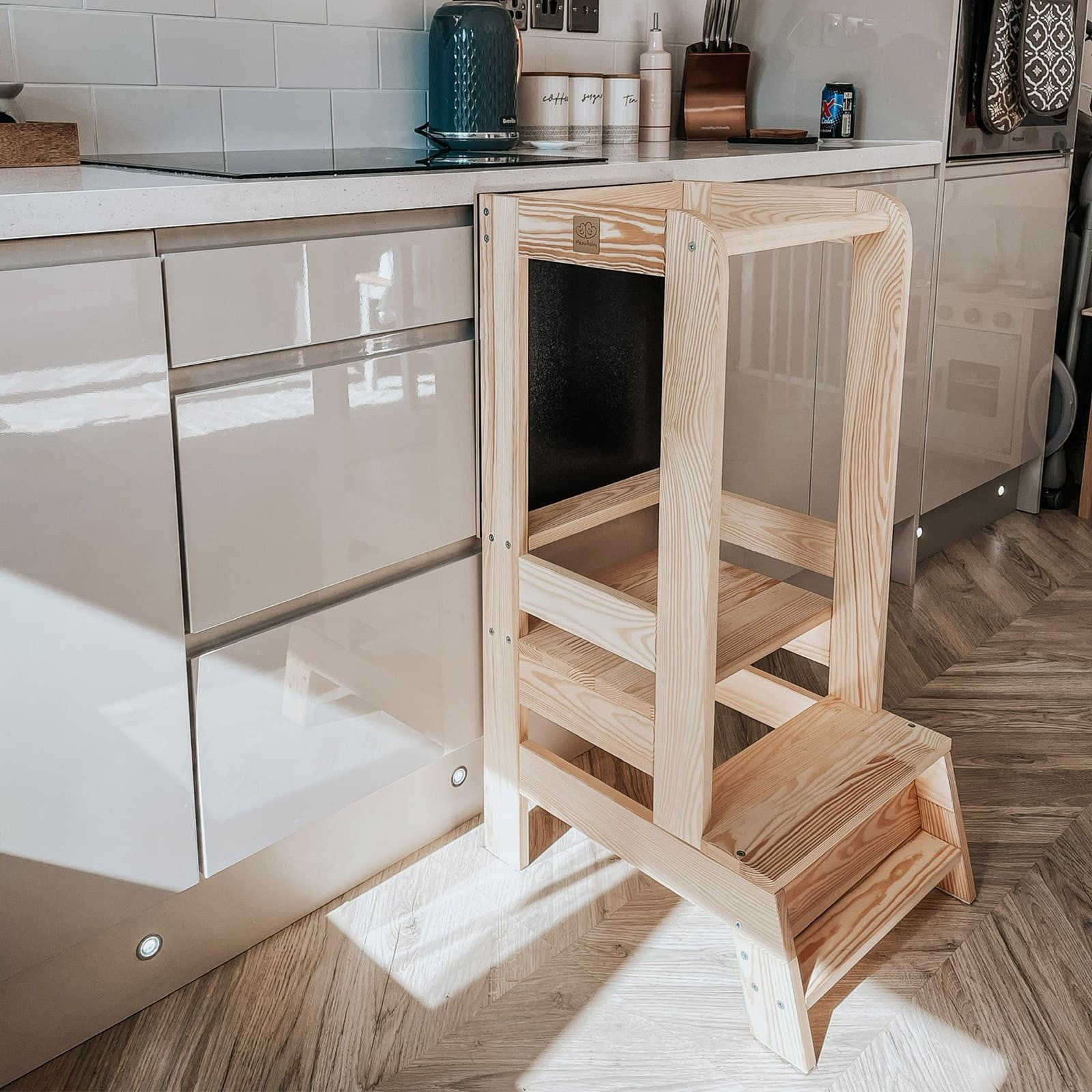 a gentle side view of the wooden kitchen helper in a cozy, sunlit home setting