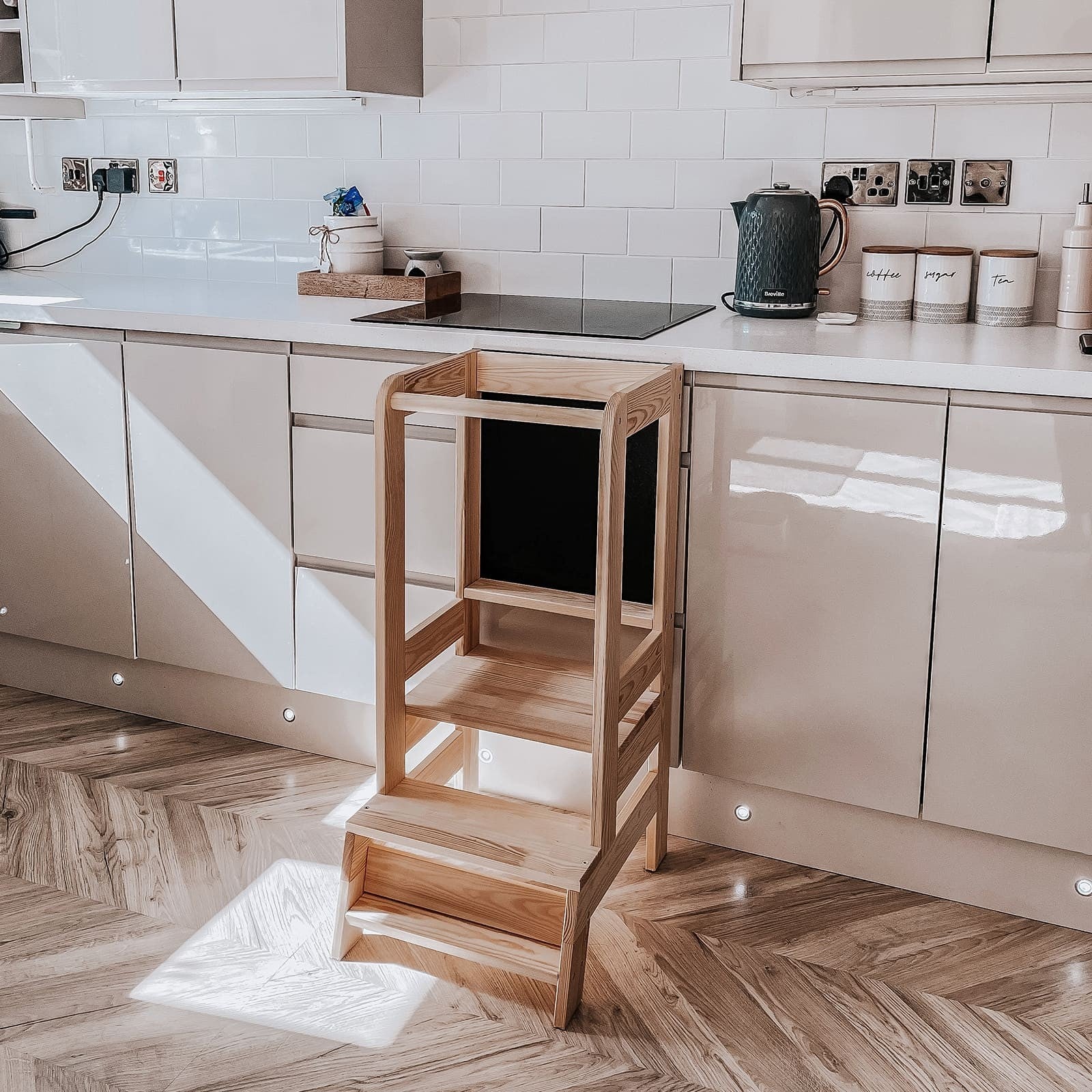 meowbaby wooden kitchen helper for kids in a bright, airy kitchen with morning light