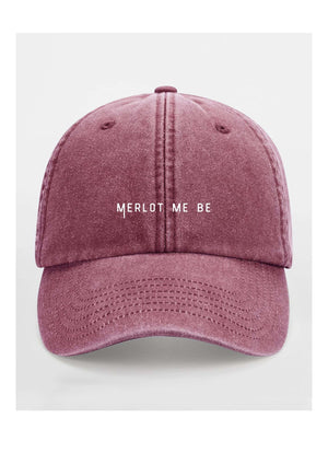 a bold merlot me be cotton cap in dramatic low-key lighting, showcasing its confident, unstructured shape