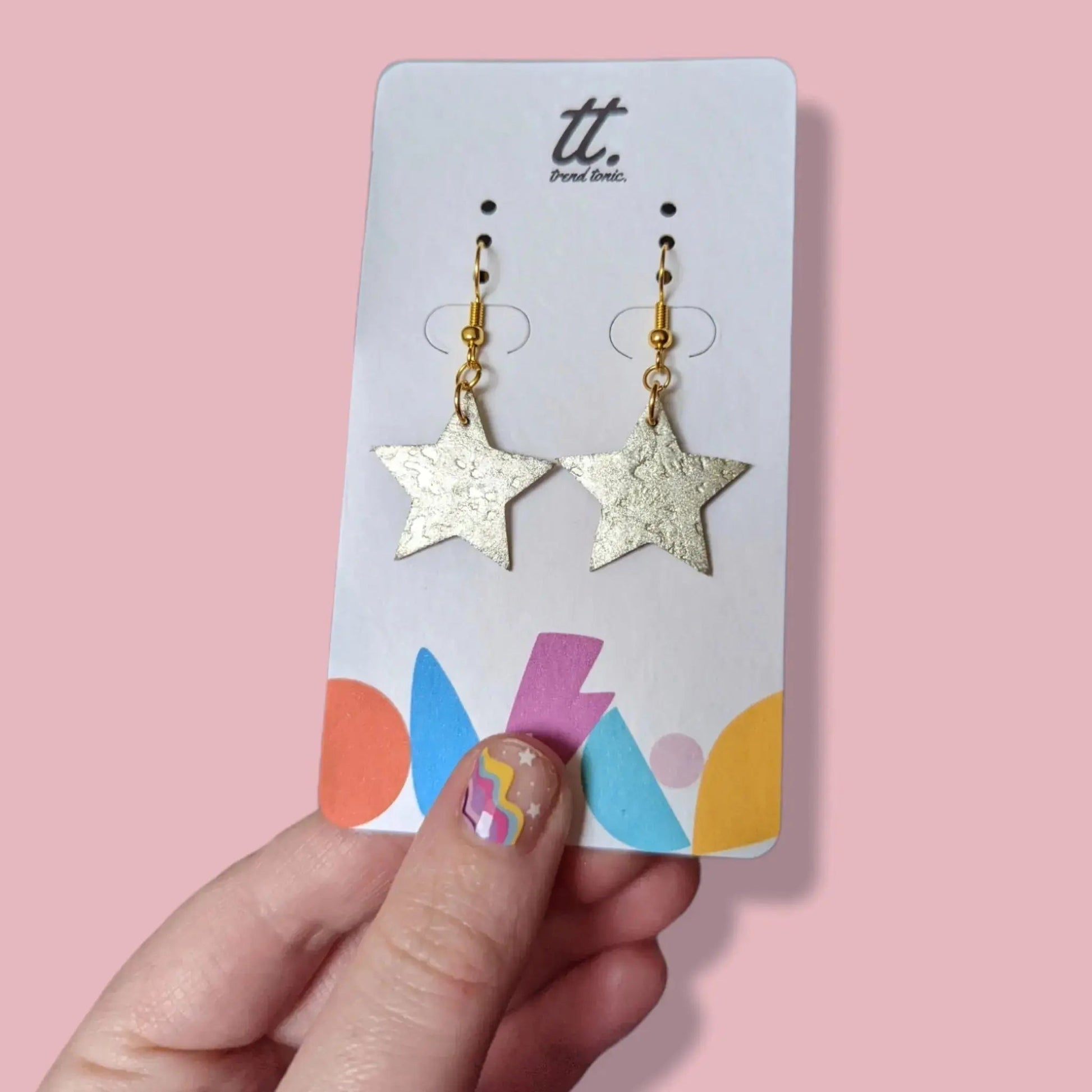 Mini gold star earrings
