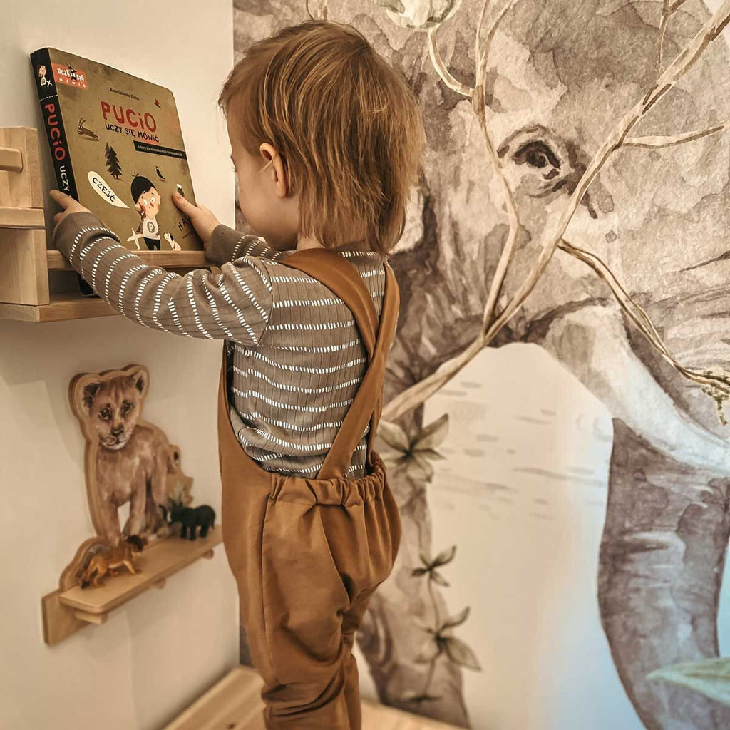 softly lit mini lion shelf in a cozy nursery corner with gentle morning light