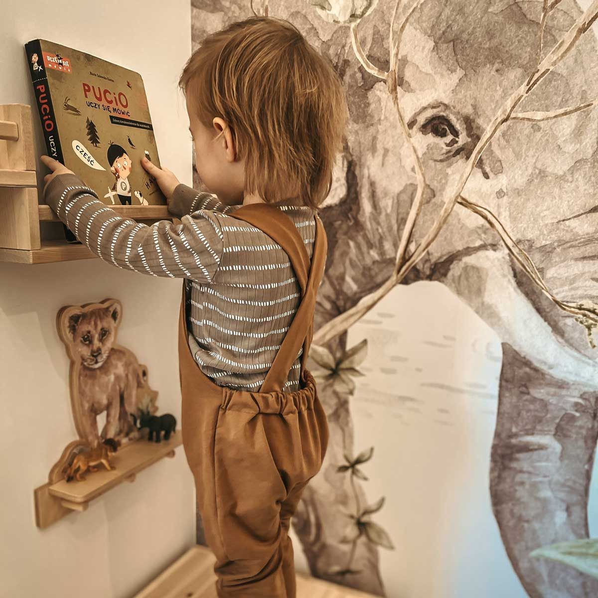 softly lit mini lion shelf in a cozy nursery corner with gentle morning light