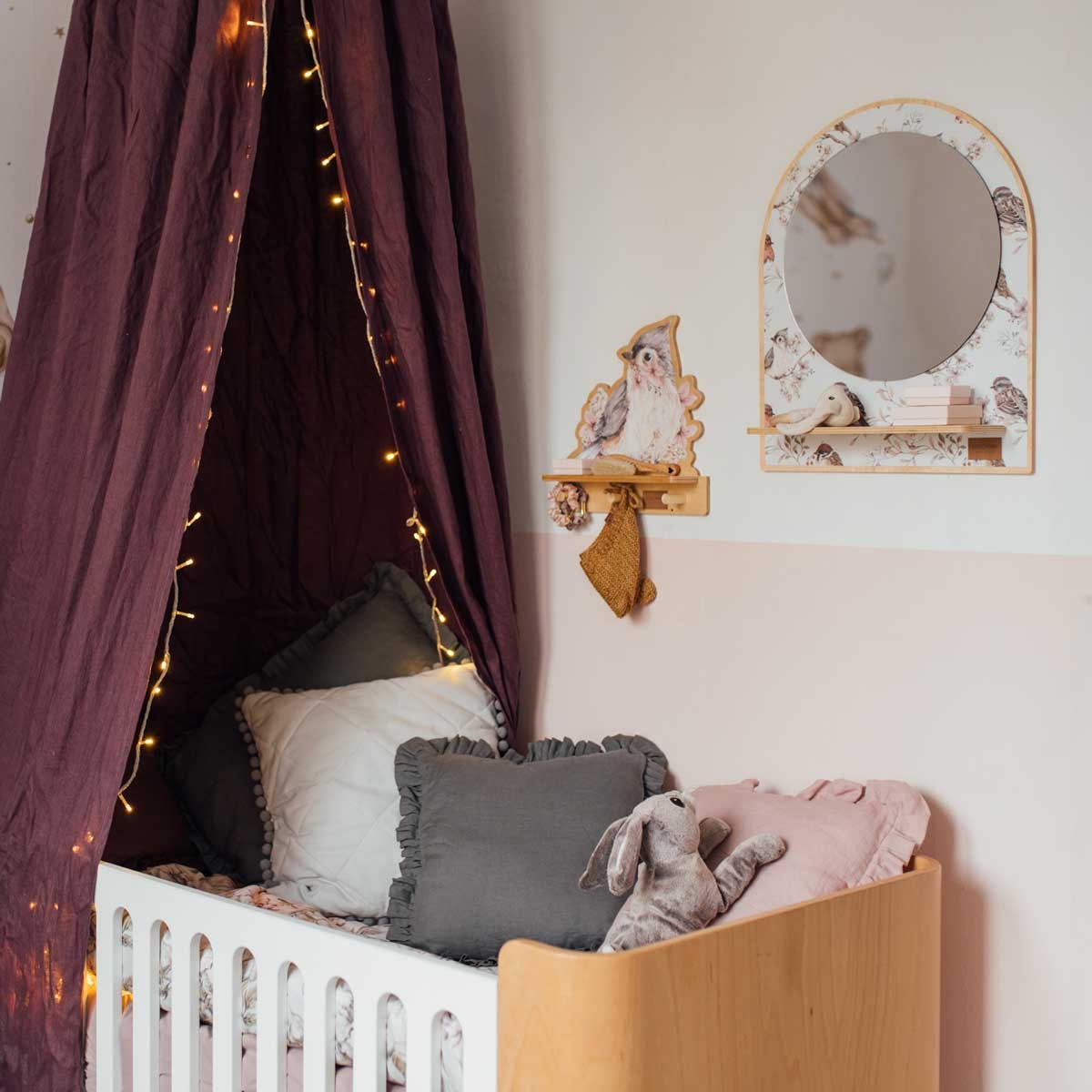 softly lit mini wall shelf with a playful bird graphic mounted in a cozy nursery corner