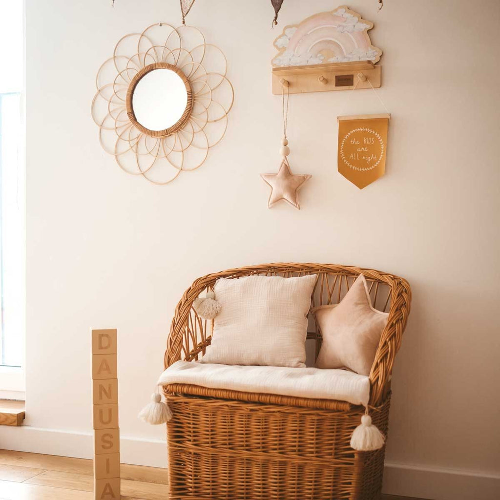 elegant pink rainbow shelf with a dinosaur print displayed in soft natural light